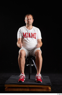  Louis  2 dressed grey shorts red sneakers sitting sports white t shirt whole body 0015.jpg